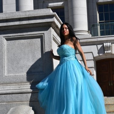 Ruth Marie in a blue gown outdoors