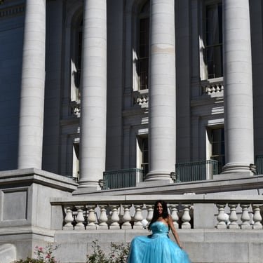Ruth Marie in a blue gown outdoors