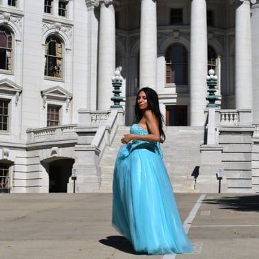 Ruth Marie in a blue gown outdoors
