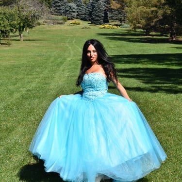 Ruth Marie in a blue gown outdoors