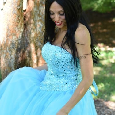 Ruth Marie in a blue gown outdoors
